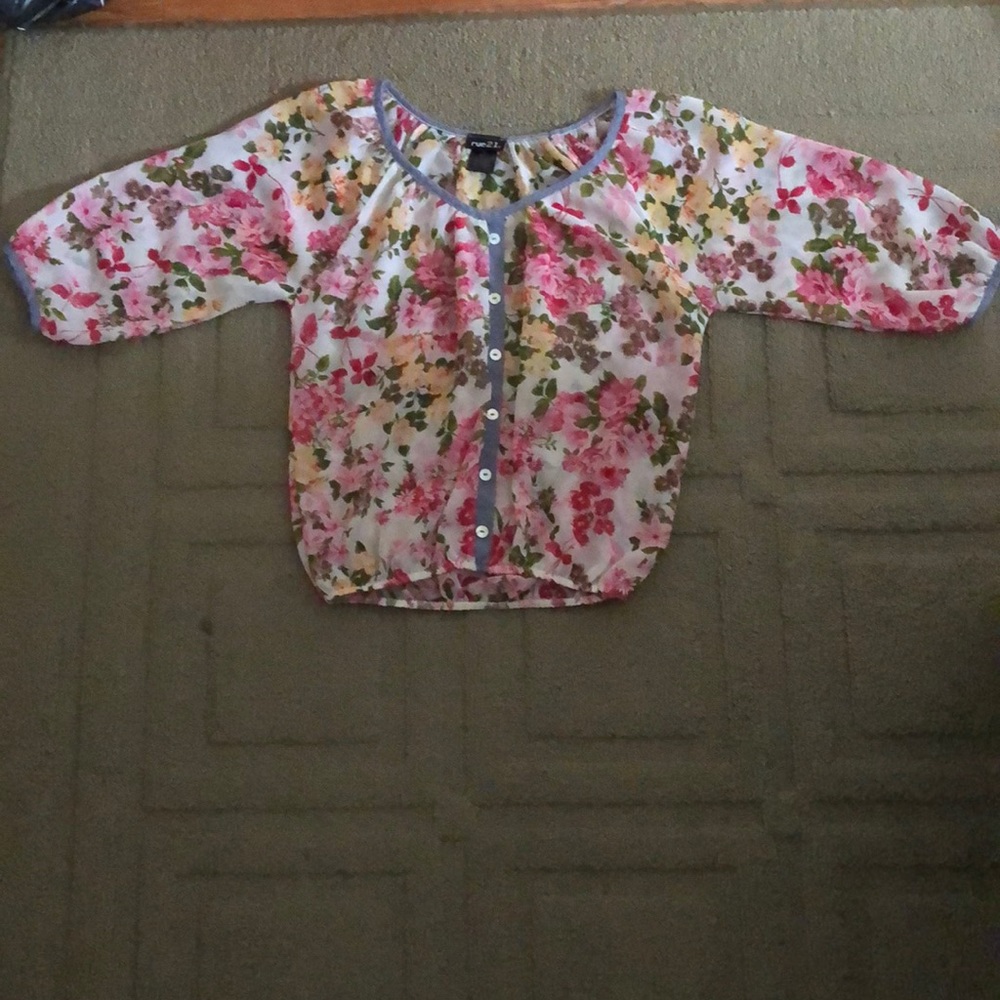 Sheer floral shirt.